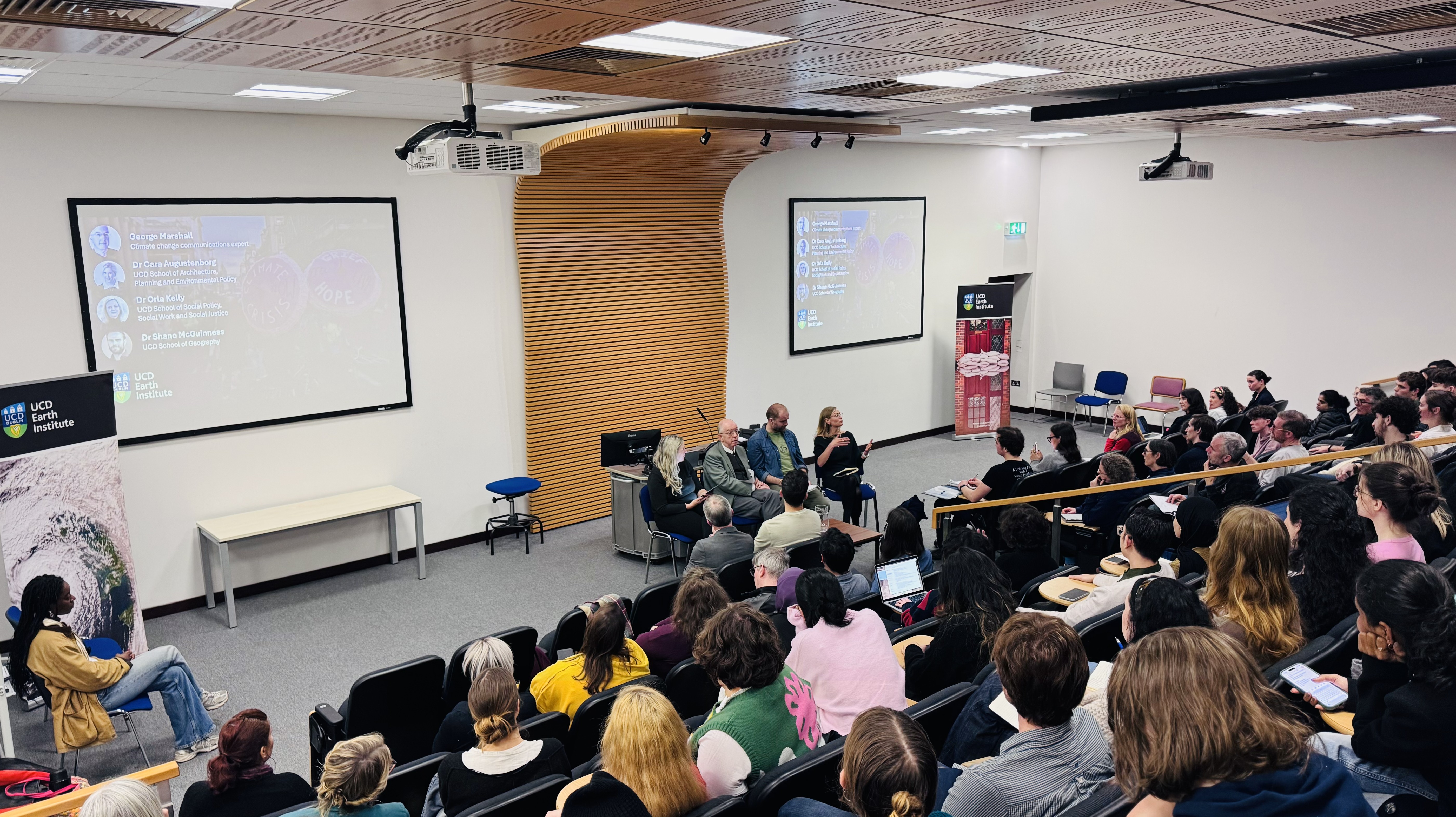 An auditorium with panel discussion